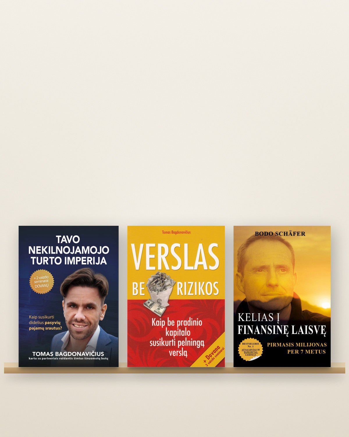 Knygos „Tavo nekilnojamojo turto imperija“, „Verslas be rizikos“ (Tomas Bagdonavičius) ir „Kelias į finansinę laisvę“ (Bodo Schäferis) lentynoje